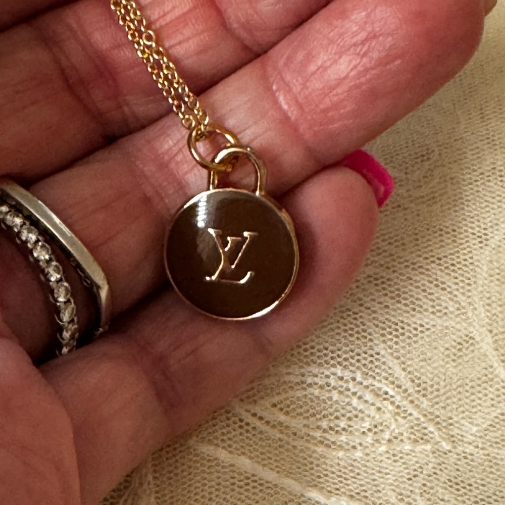 Louis Vuitton zipper pull charm necklace.